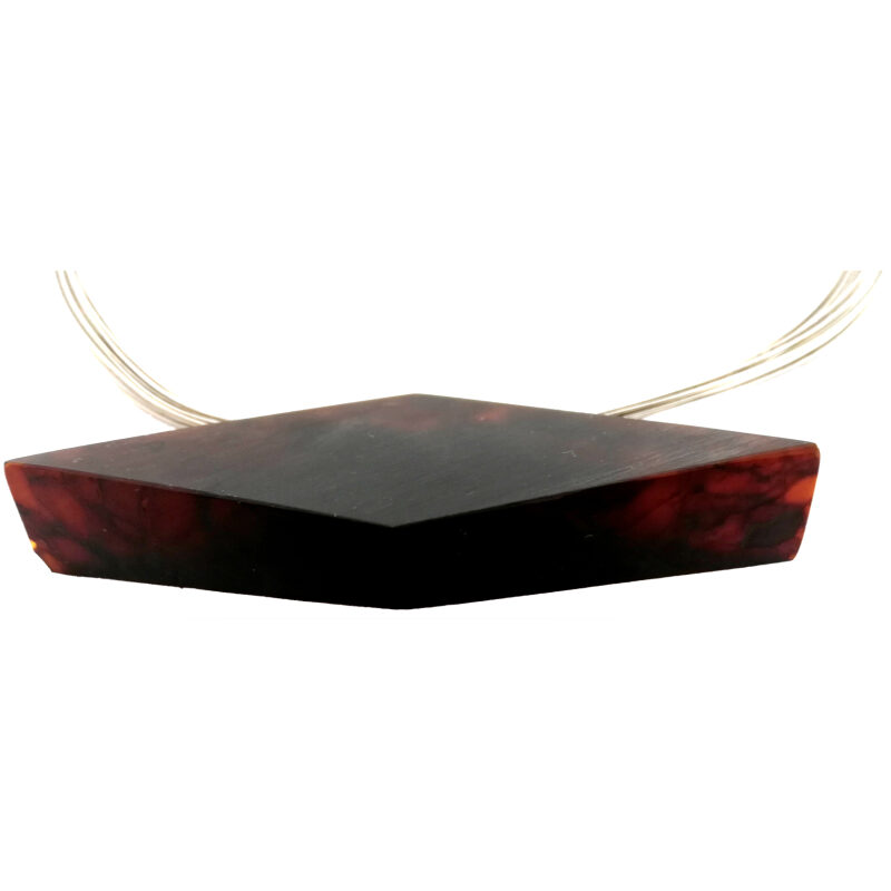 Side view of cherry Baltic amber diamond shaped necklace